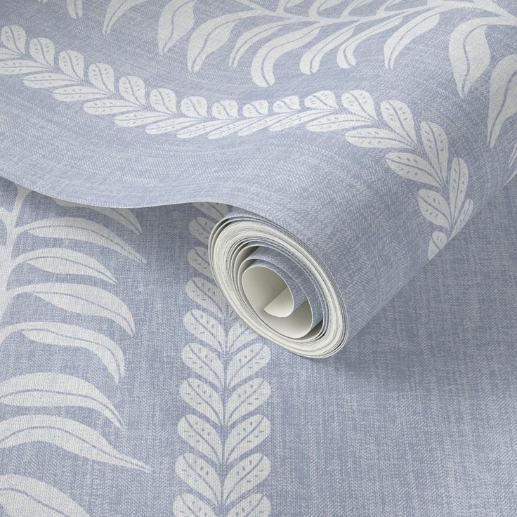 an image of a blue and white wallpaper with palm leaves on it's side