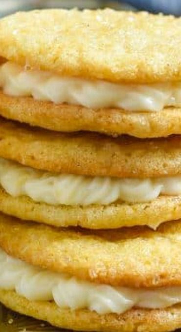 a stack of cookies with white frosting on top