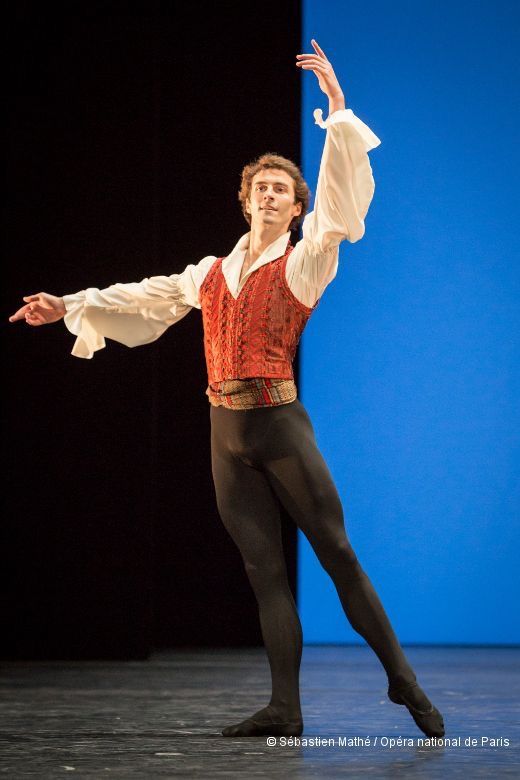 a male ballet in a red and white shirt