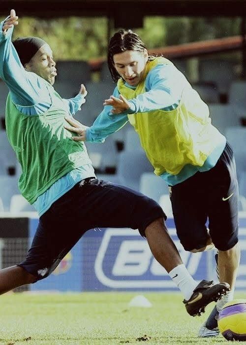 two men are playing soccer on the field