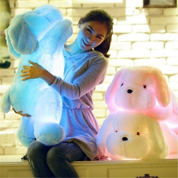 Our Glowing LED dog plushies is a soft and cuddly friend who also glows in the dark! These super bright LED glowing dog plush toys are the most realistic soft toy dogs on the market today. Just turn on the LED light therapy, and watch them grow. They are also made of high-quality soft materials and filled with PP cotton, which is comfortable to touch and cuddly. These colorfully designed animal plush toys will be your kids' favorites for sure! FEATURES ☁️ 100% premium quality cotton. ⭐️ Perfect Xmas Gifts For Kids, Dog Light, Teddy Dog, Dog Doll, Soft Stuffed Animals, Cool Gifts For Kids, Hot Gifts, Dog Leads, Plush Dog