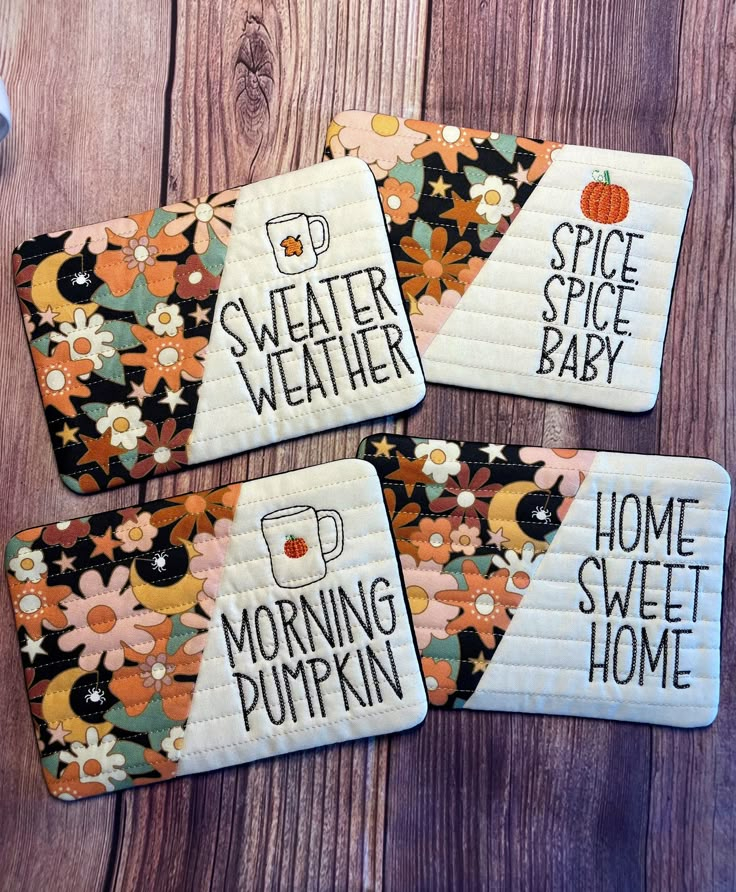 four coasters with words on them that say, sweet weather and home sweet pumpkin