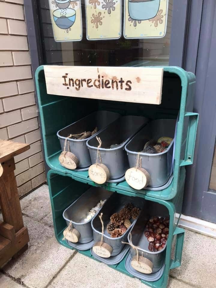 an old metal shelf filled with buckets next to a sign that says ingredients on it