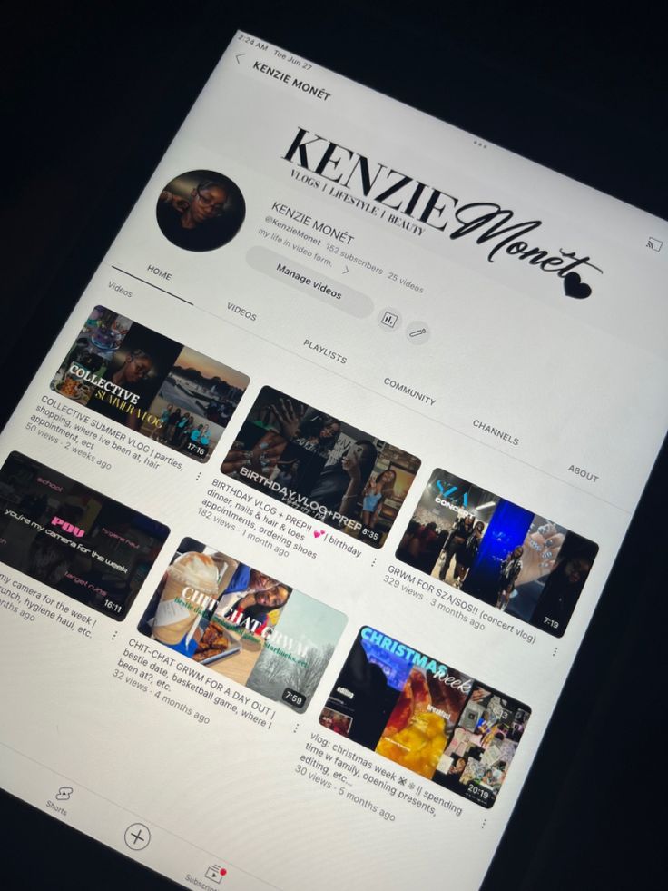 the website for kenzi films is displayed on a tablet