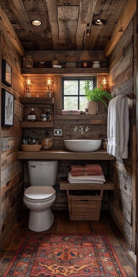 a bathroom with wooden walls and flooring, including a rug on the floor next to the toilet