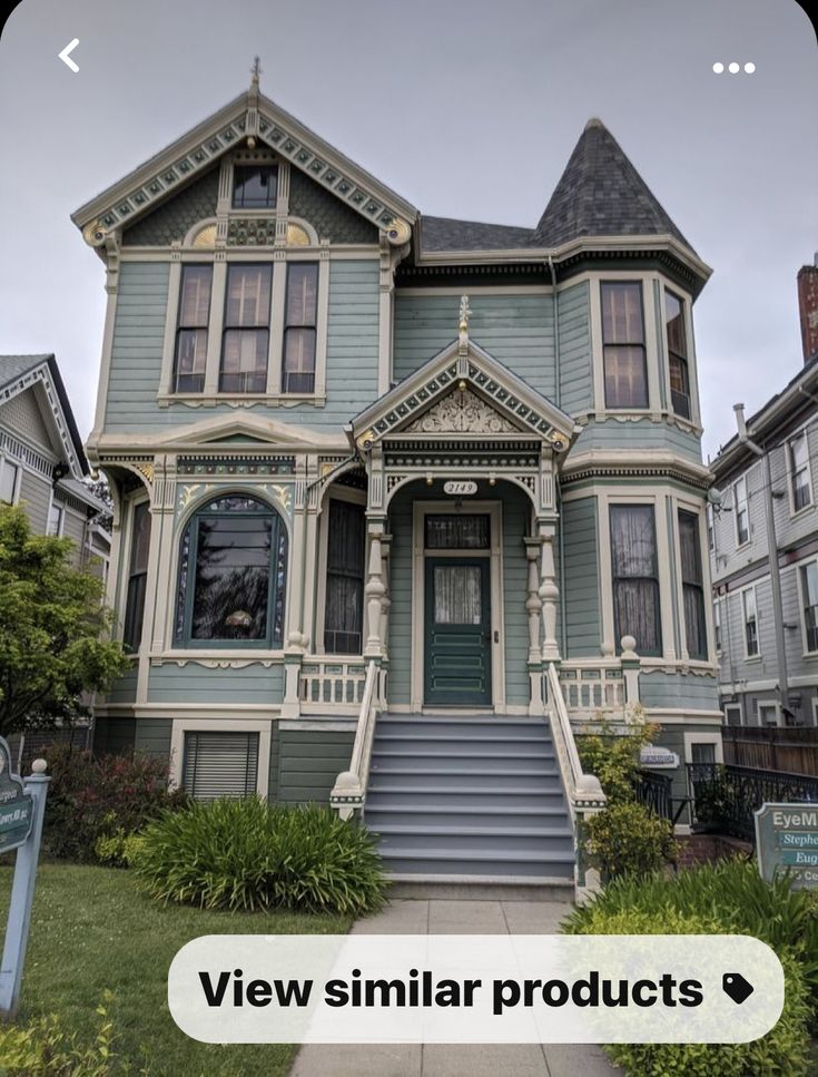 an old victorian style house with blue trim