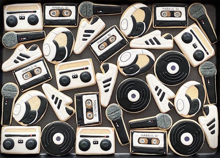 an assortment of decorated cookies in the shape of old school radio equipment