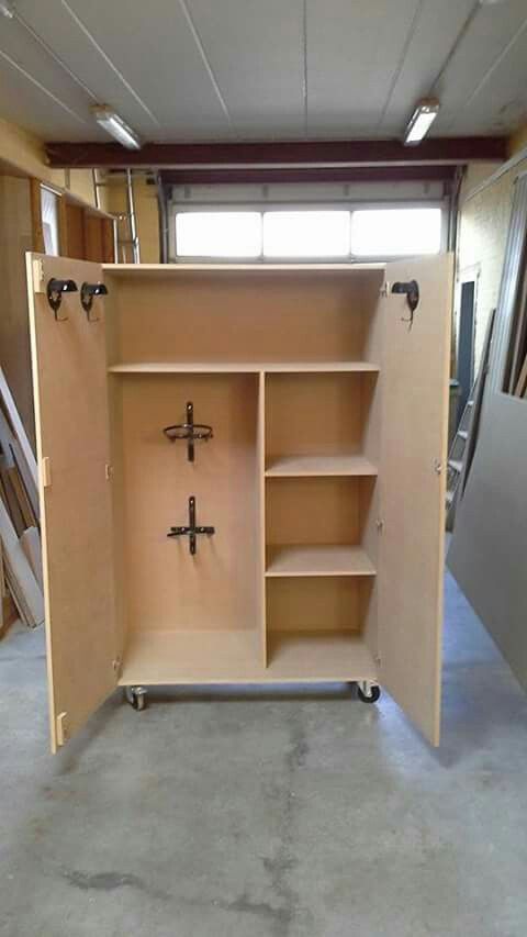 the inside of a storage unit with shelves and doors open in a room that is being remodeled