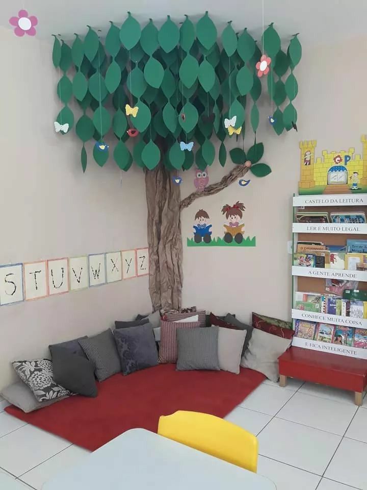 an image of a tree in the middle of a room with lots of books on it