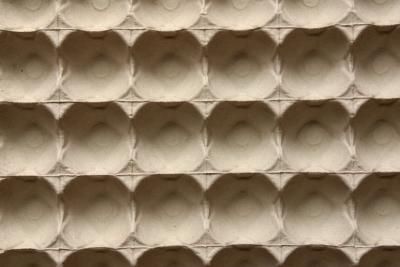 a wall made out of concrete blocks with holes in the middle