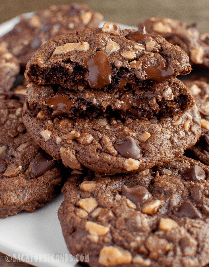 chocolate cookies are stacked on top of each other