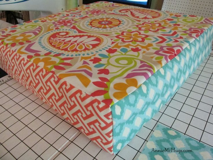 a colorful table cloth is sitting on the floor