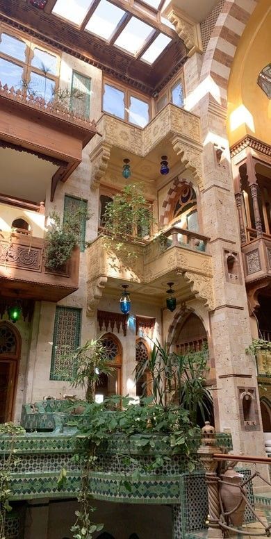 the inside of a building with lots of windows and balconies on each floor