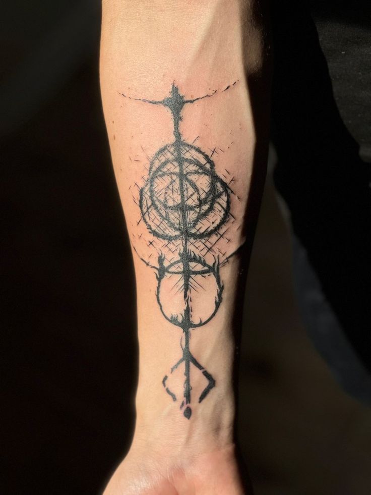 a person's foot with a tattoo on it and a compass in the middle