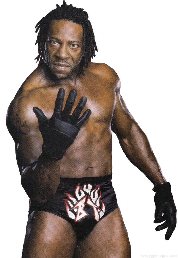 a man with no shirt and gloves standing in front of a white background wearing wrestling gear