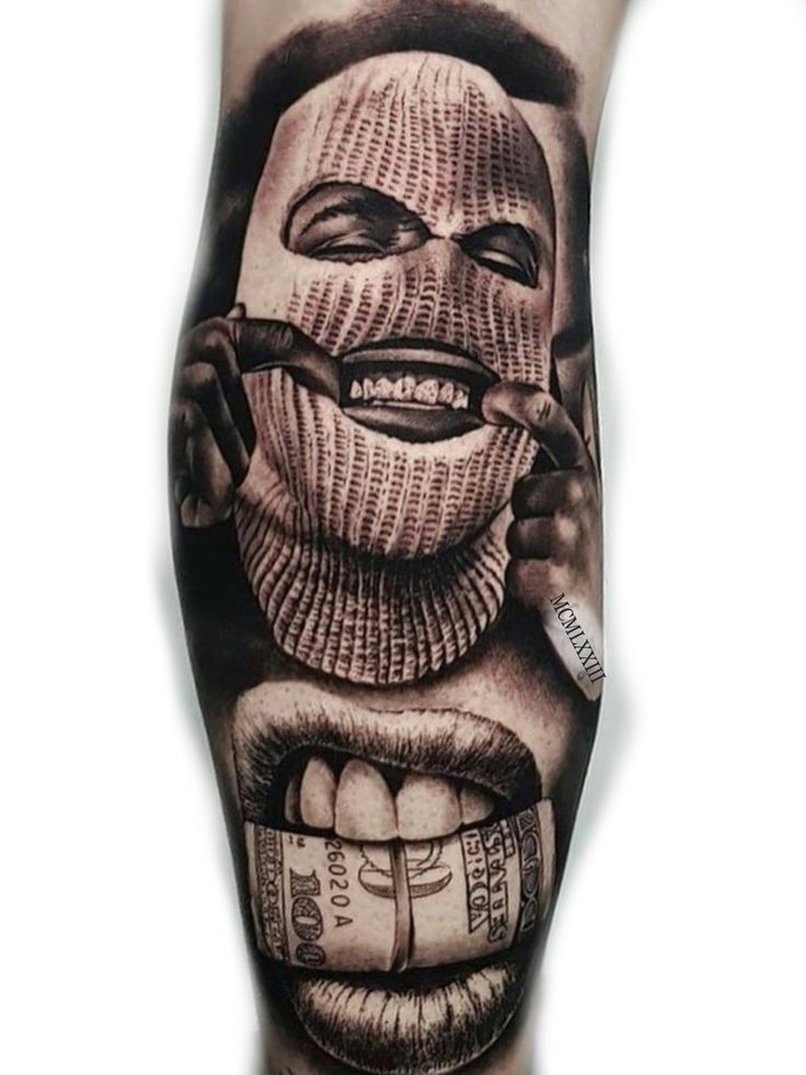 a man's leg with an image of a clown on it and money coming out of his mouth