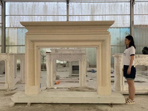 a woman standing in front of a white fireplace inside of a room filled with furniture