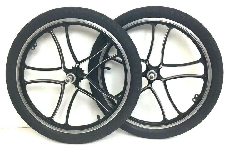 two black wheels with spokes on white background