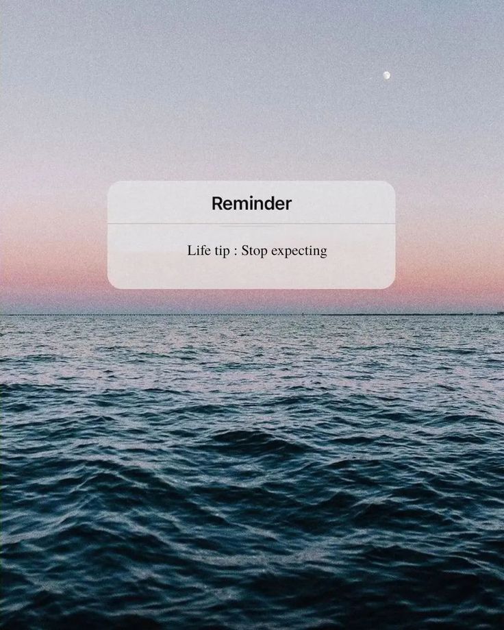 an image of the ocean with text reading reminder life tip stop expecting