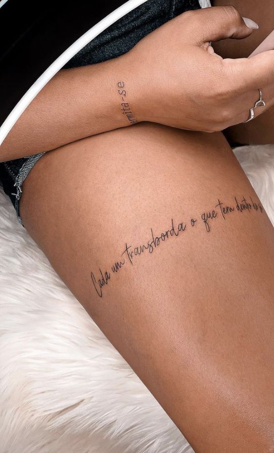 a woman's leg with the words you are transcended to your own limits tattooed on it