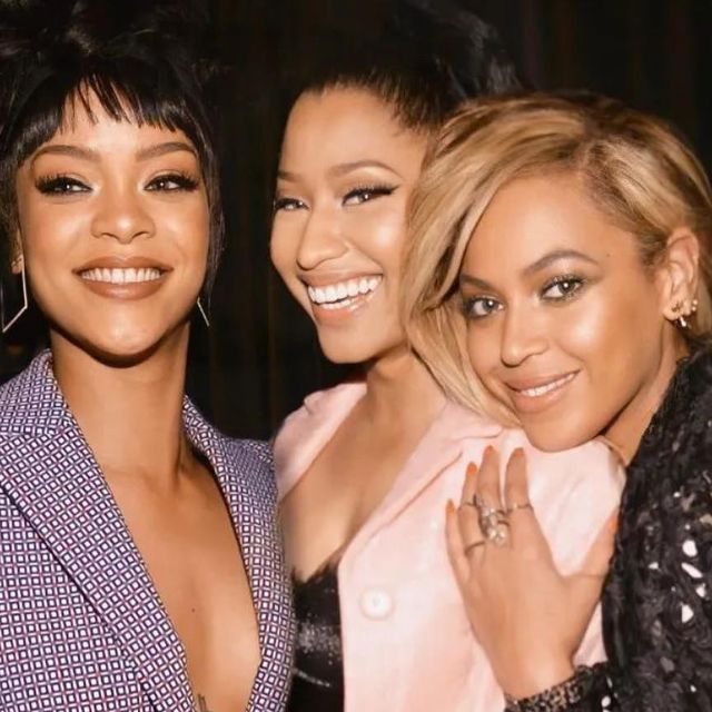 three women are posing for the camera together