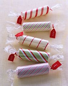 four candy canes wrapped in plastic wrappers