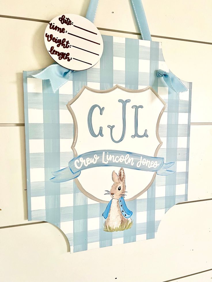 a blue and white sign hanging on the side of a building that says cjl