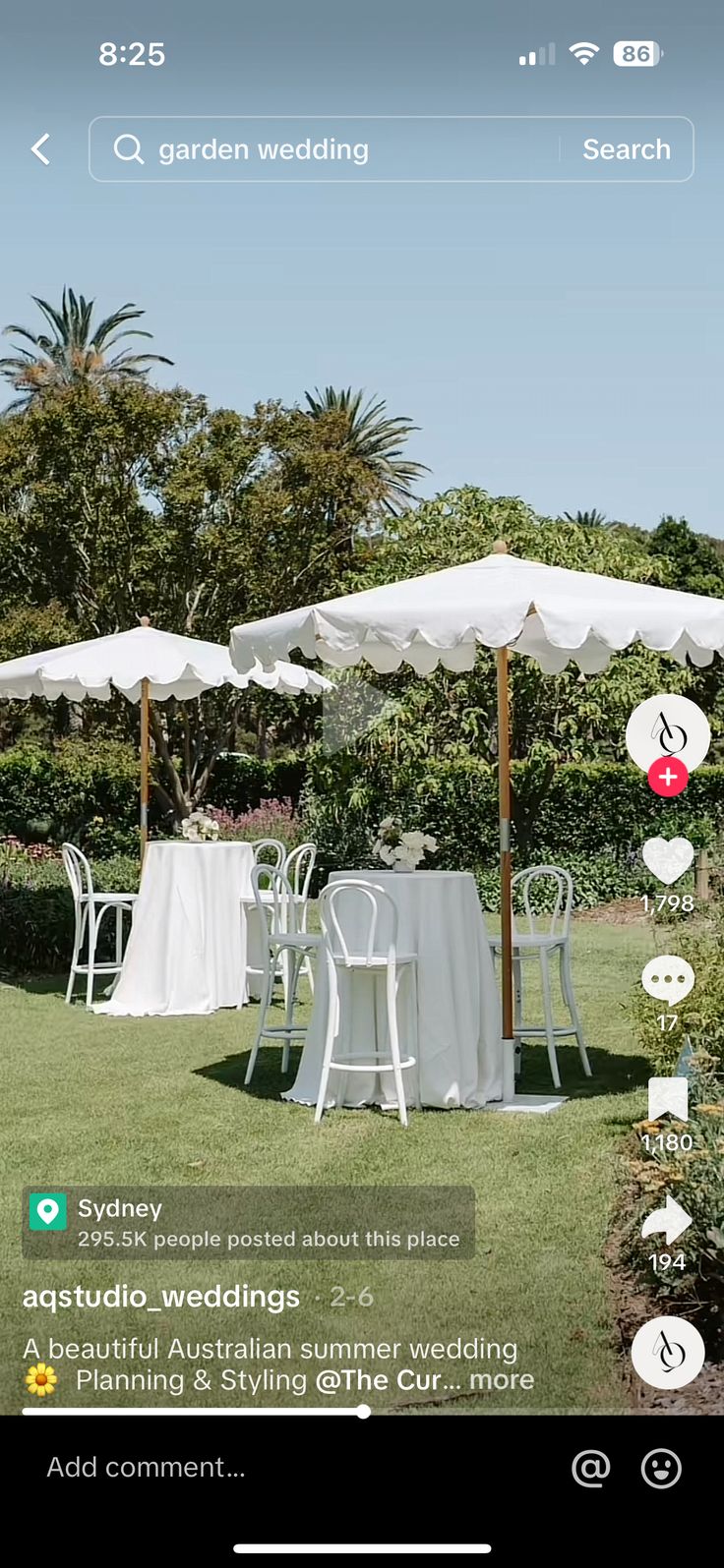 an outdoor wedding with white tables and umbrellas