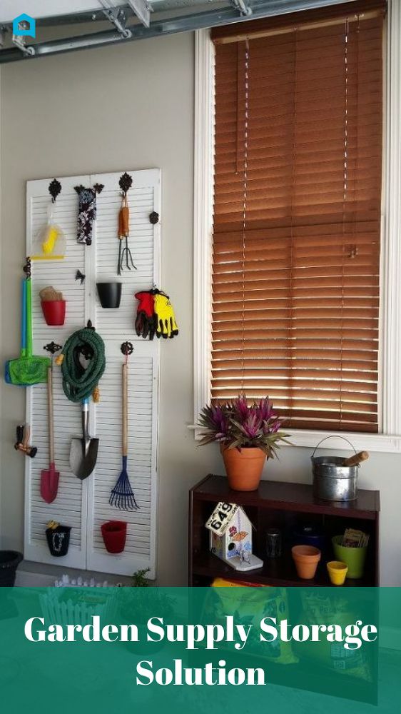 there is a shelf with gardening utensils on it