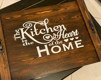 a wooden sign that says kitchen is the heart of the home