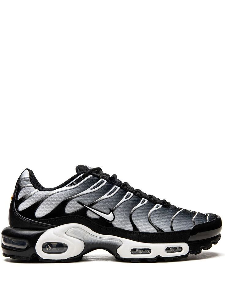 Air Max Plus low-top sneakers from Nike featuring black, grey, white, signature Swoosh logo detail, round toe, front lace-up fastening, logo patch at the tongue, branded insole and rubber sole with Max Air cushioning. These styles are supplied by a premium sneaker marketplace. Stocking only the most sought-after footwear, they source and curate some of the most hard to find sneakers from around the world.. Nike A, Tn Plus, Nike Tns, Nike Air Plus, Nike Tn Shoes, Nike Air Max Plus Black, Air Max Plus Tn, Black And White Nikes, Nike Max