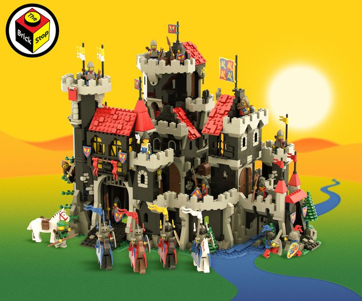 a castle made out of legos on a green field with the sun in the background