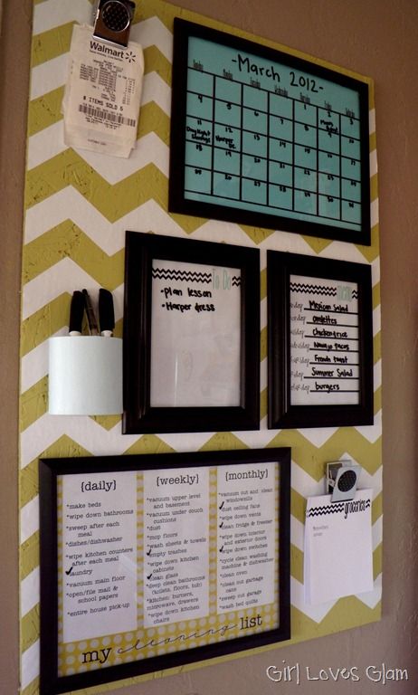 a bulletin board on the wall with pictures and calendars