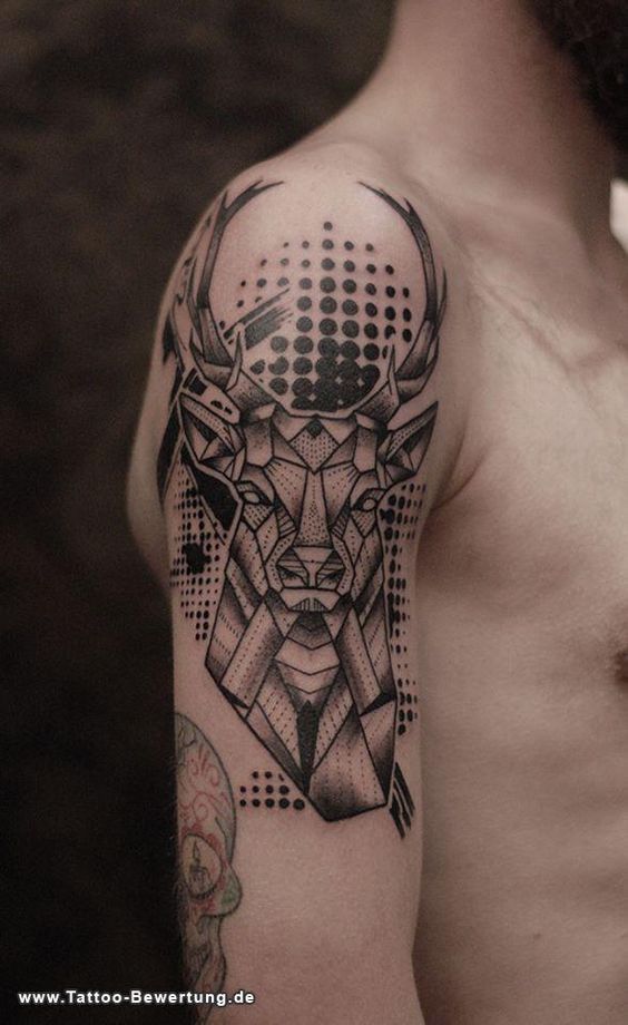 a man with a tattoo on his arm has a deer head and geometric shapes in the background