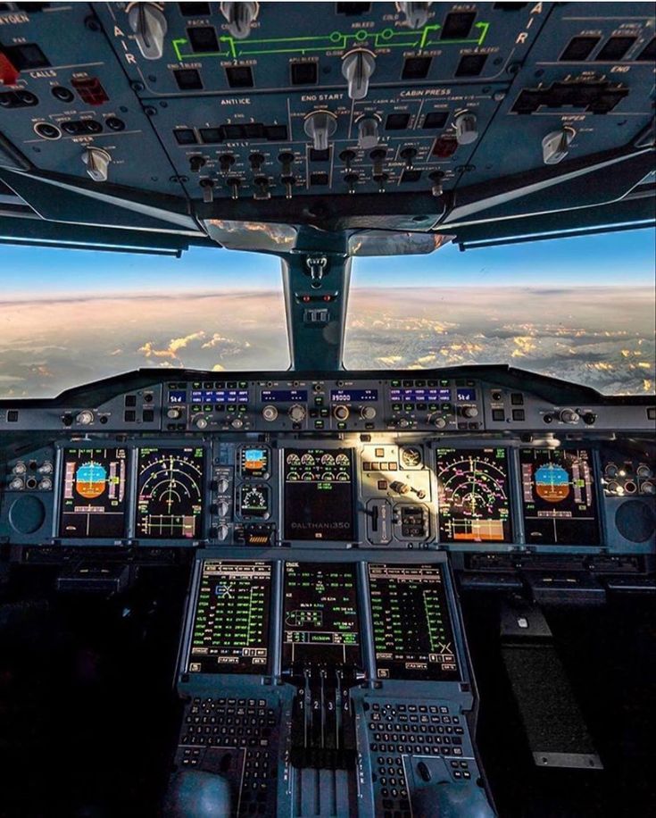 the view from inside an airplane looking down at the cockpit and pilot's instruments