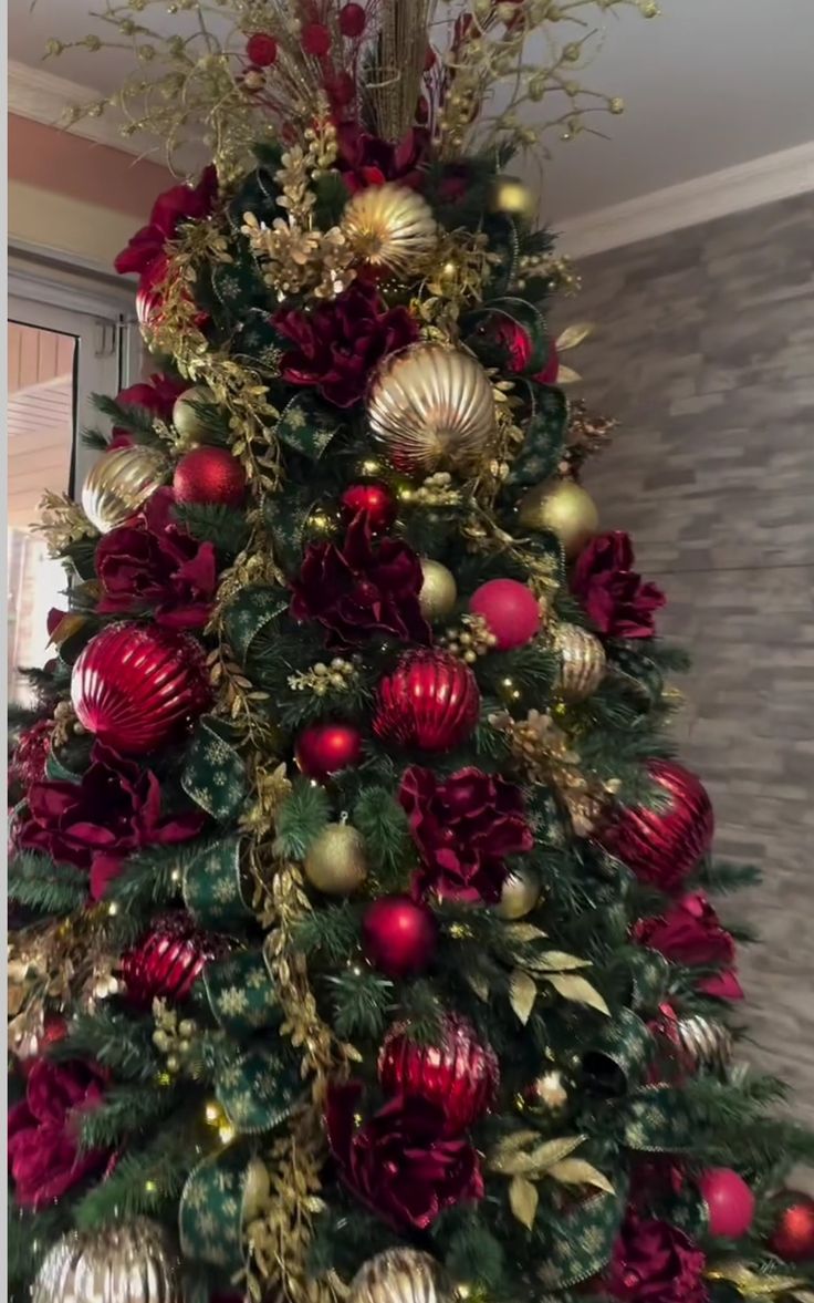 a christmas tree with red and gold ornaments