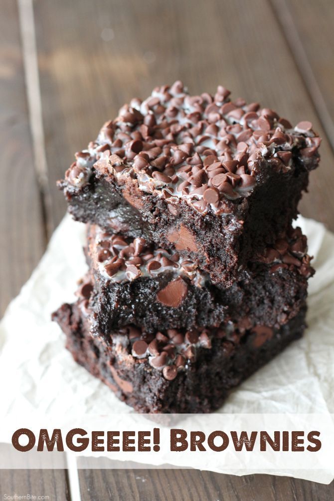 a close up of a piece of cake with chocolate and nuts on it's top