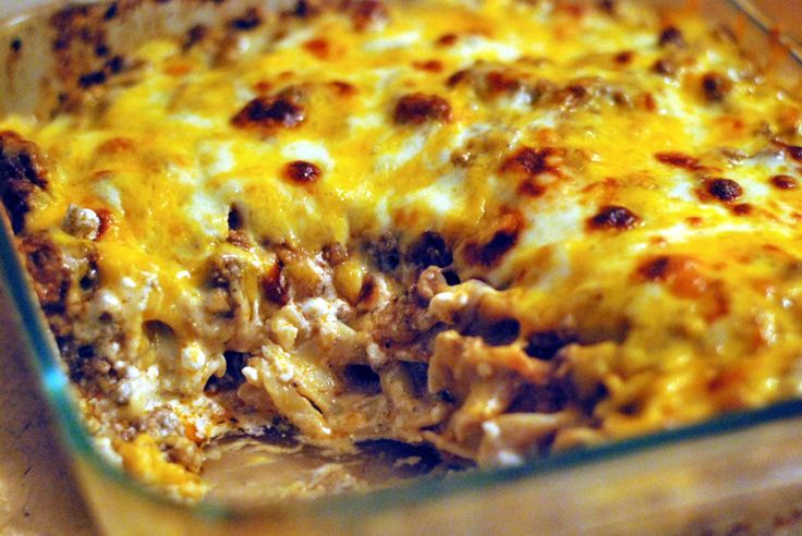 a casserole dish filled with meat and cheese