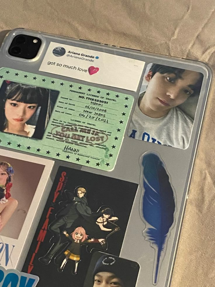 a cell phone case with photos and stickers on it