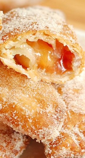 some sugar covered pastries on a white plate