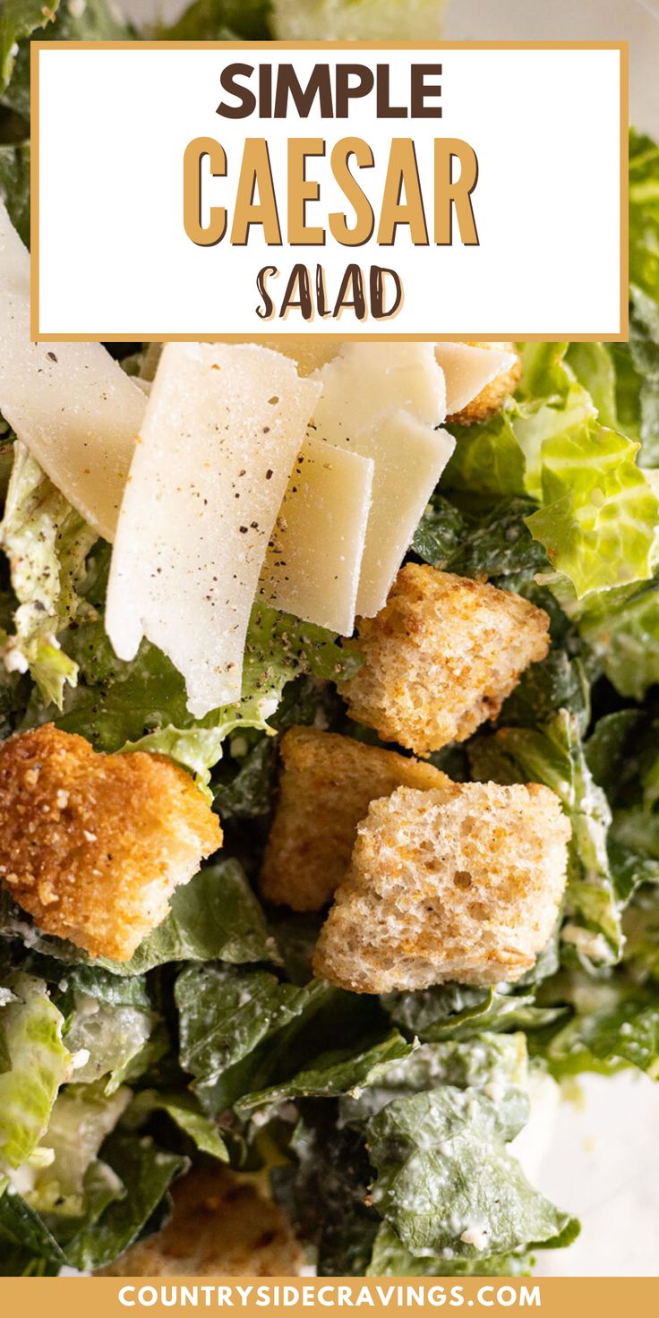 a salad with croutons and parmesan cheese on top