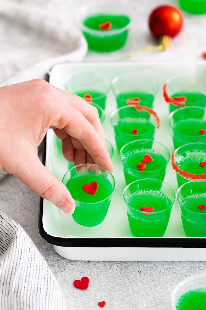 Grinch Jello Shots – Snacks and Sips Christmas Grinch Jello Shots, Grinch Jello Shots Recipe, Jello Shot Christmas Tree, Christmas Jell-o Shots, Jello Shots Christmas, Grinch Jello Shots, Grinch Jello, Holiday Jello Shots, Easy Shot Recipes