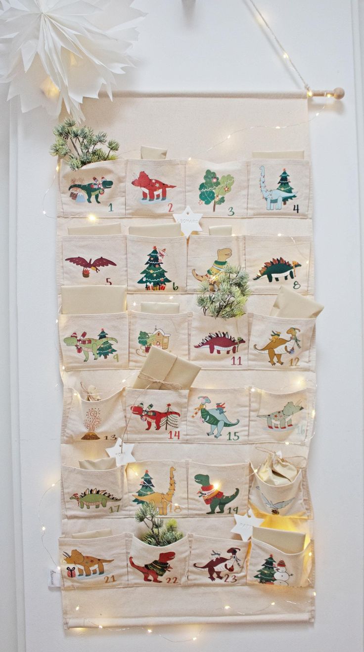 a wall hanging with christmas decorations on it