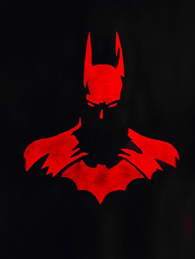 the silhouette of batman in red against a black background