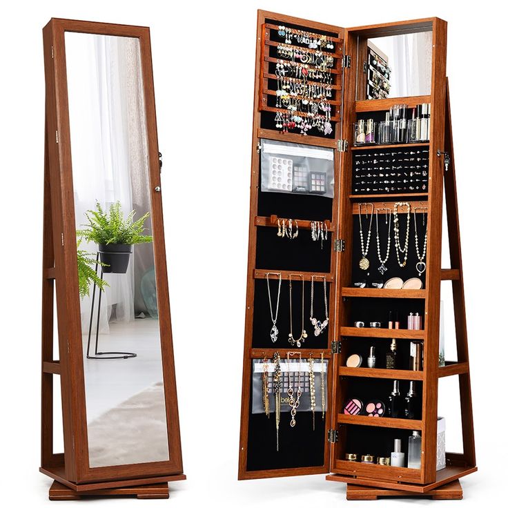 a large wooden jewelry cabinet with mirrors on it