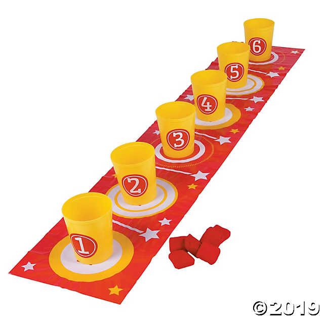 a red table runner with yellow cups and plates on it that have the number thirteen on them