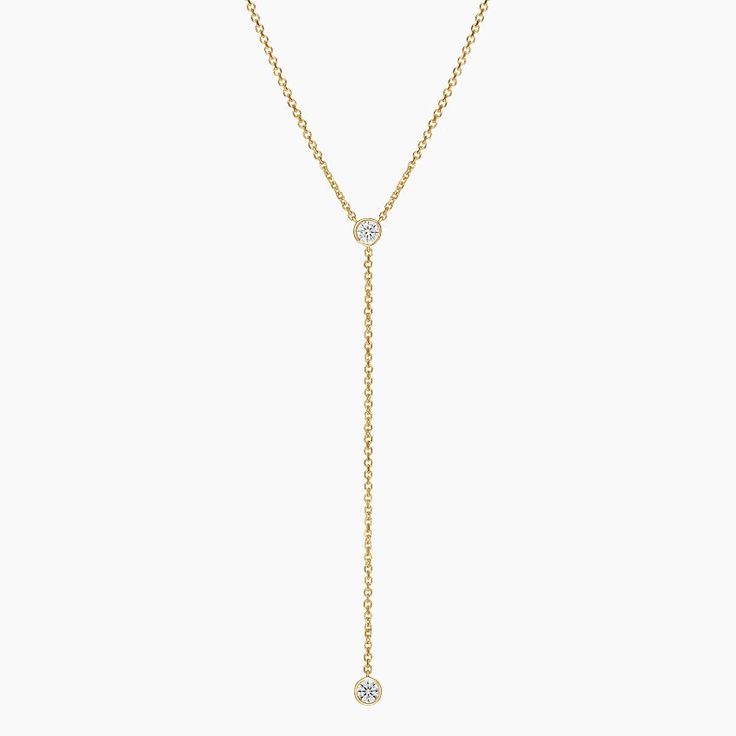 Lab Diamond Bezel Lariat Necklace - 14K Yellow Gold. A chic classic, this lariat necklace features two bezel-set lab diamonds gracefully resting on a chain that can be adjusted to 18, 19, or 20 inches to suit individual preference (1/5 total carat weight). Classic Formal Lariat Necklace With Clavicle Chain, Classic White Gold Lariat Necklace, Formal Yellow Gold Backdrop Necklace With Clavicle Chain, Classic Formal Lariat Necklace With Adjustable Chain, Classic Long Drop Lariat Necklace For Formal Occasions, Formal Yellow Gold Backdrop Necklace With Delicate Chain, Classic Long Drop Lariat Necklace For Formal Events, Formal Yellow Gold Backdrop Necklace, Minimalist Lariat Diamond Necklace For Formal Events