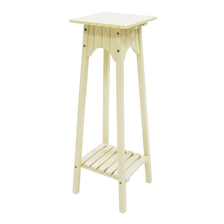 a white wooden table with a shelf on the side