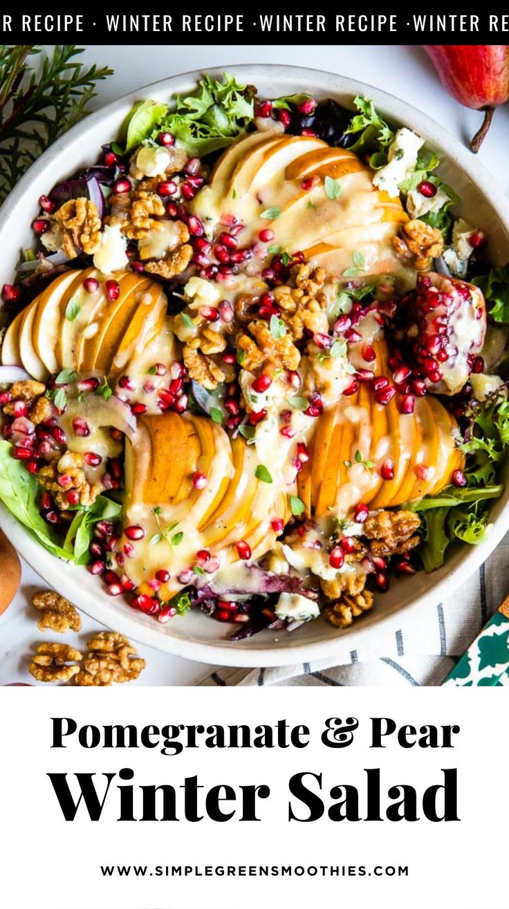 a white bowl filled with pomegranate and pear winter salad on top of a table