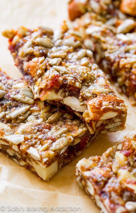 some kind of granola bar sitting on top of a piece of parchmented paper